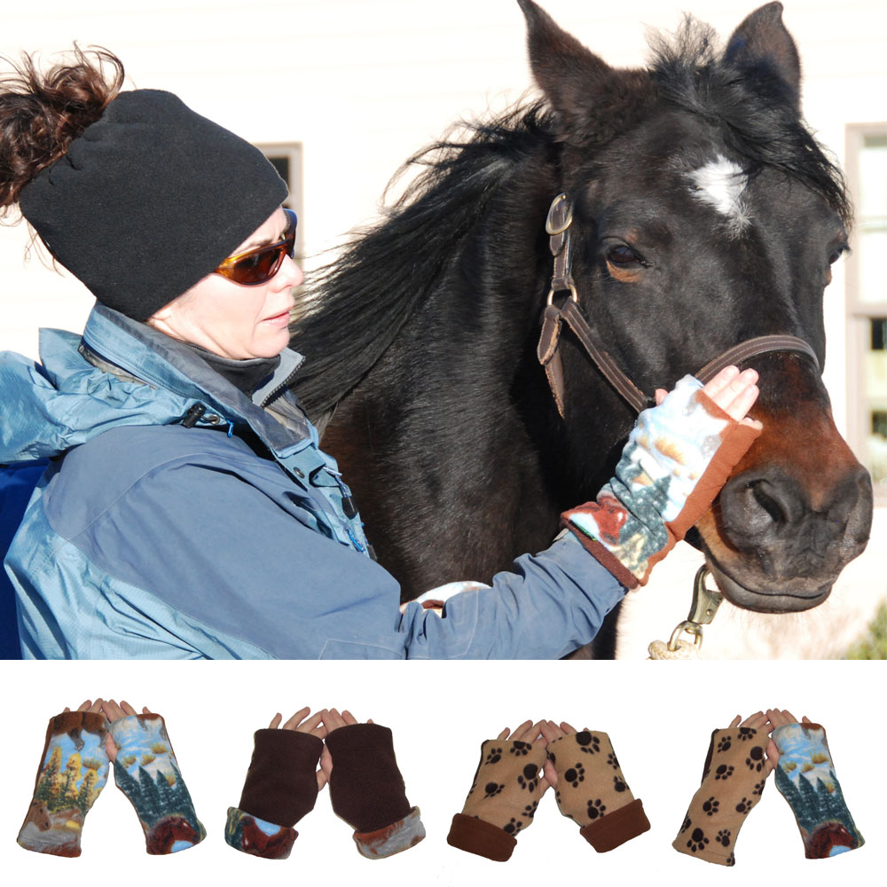 A woman wearing winter clothes cuddles a black horse outdoors.